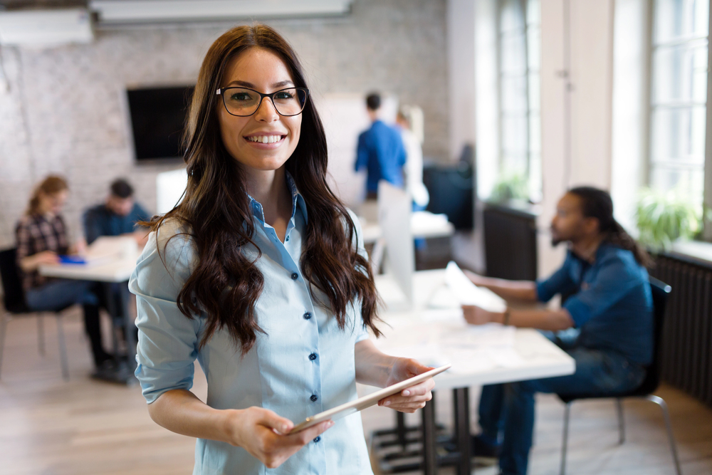 Woman smiling in trendy coworking space